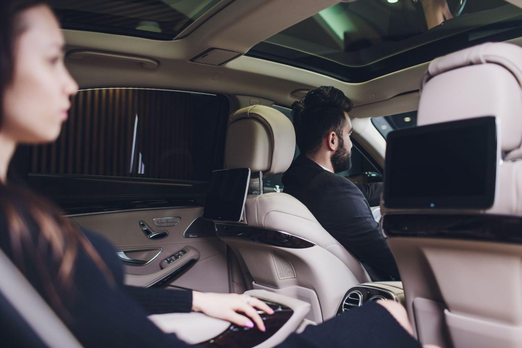 executive-businesswoman-in-car-1024x683